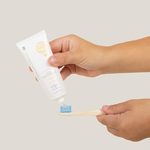 CariFree Naturals Kids Toothpaste | Fluoride-Free, 40% Xylitol, Organic Wild Berry Flavor, pH Elevated, Safe if Swallowed, Sugar-Free, 2.4 oz, Made in The USA
